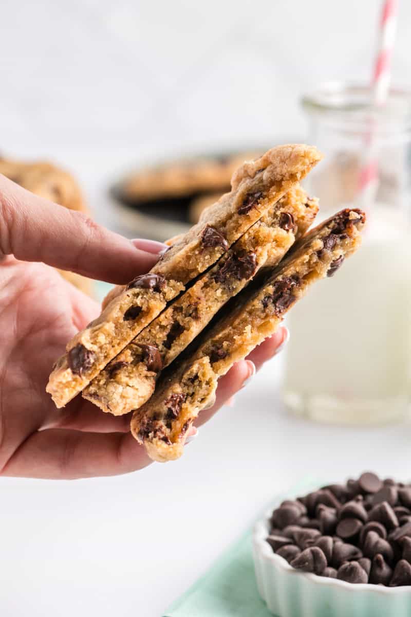 Close up of broken Best Big Fat Chewy Chocolate Chip Cookies in hand.