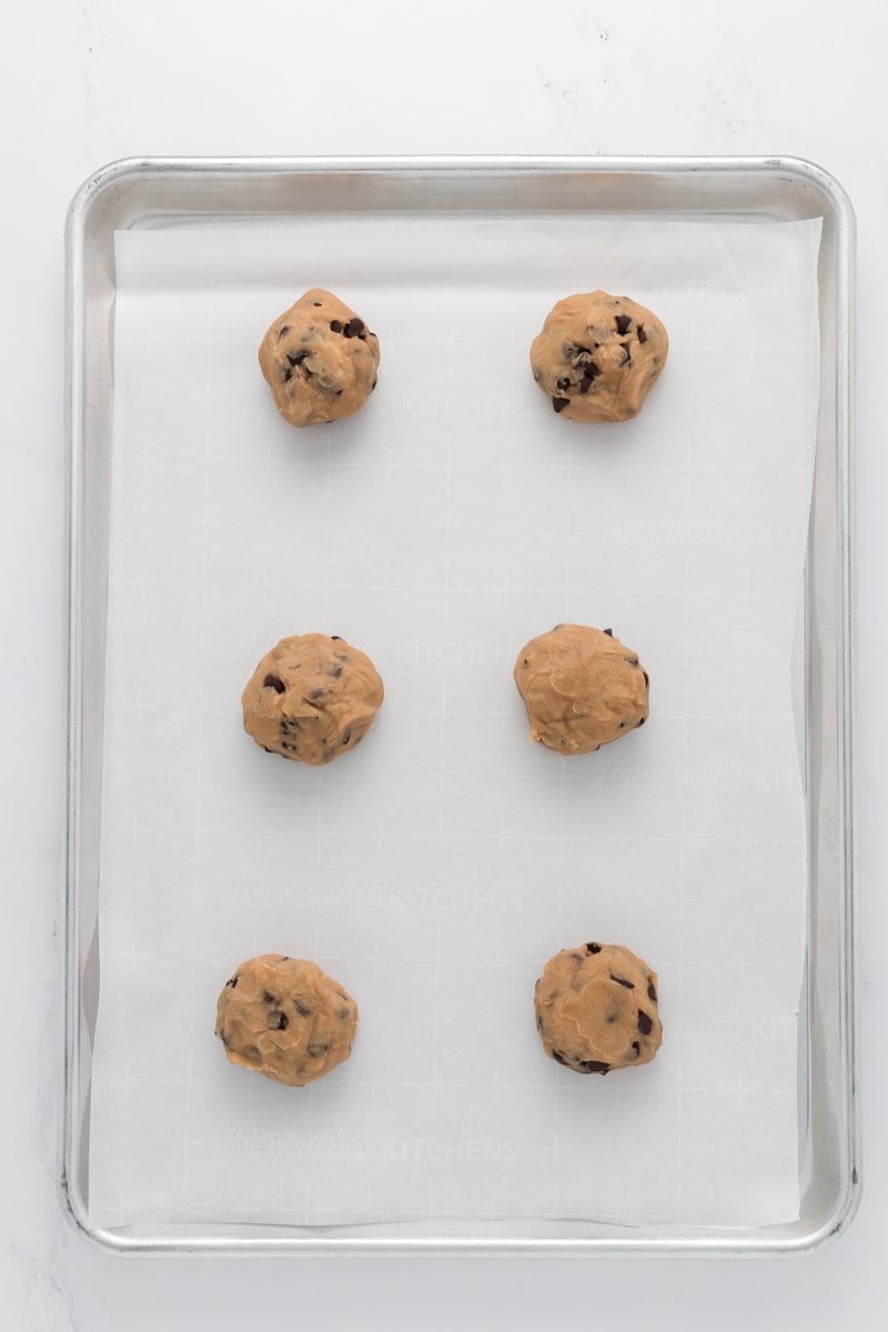 Overhead shot of frozen dough balls for Best Big Fat Chewy Chocolate Chip Cookies.