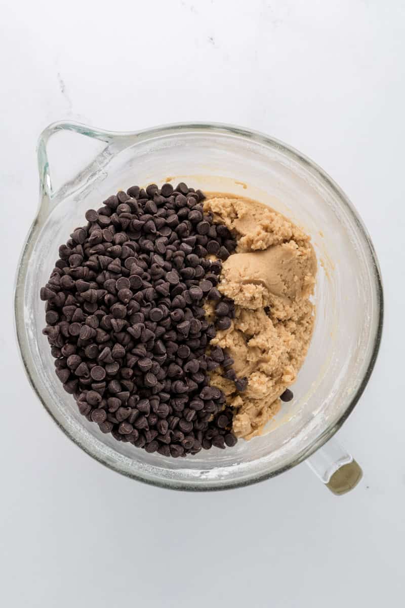 Overhead shot of cookie dough with chocolate chips for Best Big Fat Chewy Chocolate Chip Cookies.