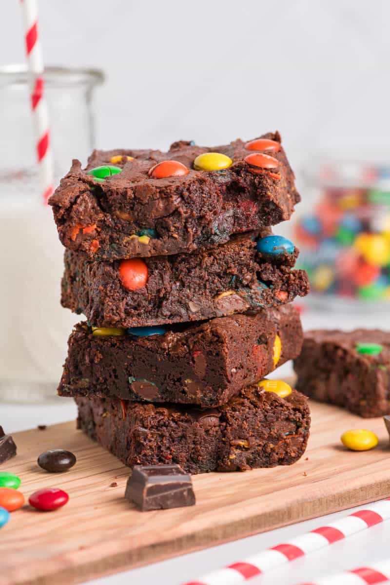 Close up side shot of stacked M&M Brownies.