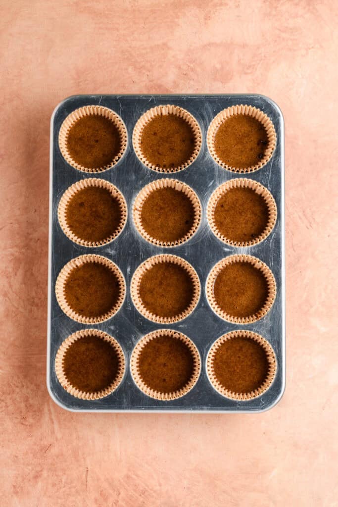 Overhead shot of cake Gingerbread Cupcakes batter in cupcake pan.