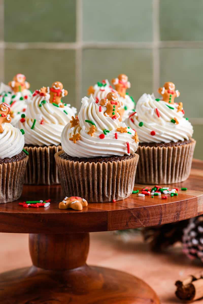 Close up shot of Gingerbread Cupcakes on wood cake stand.
