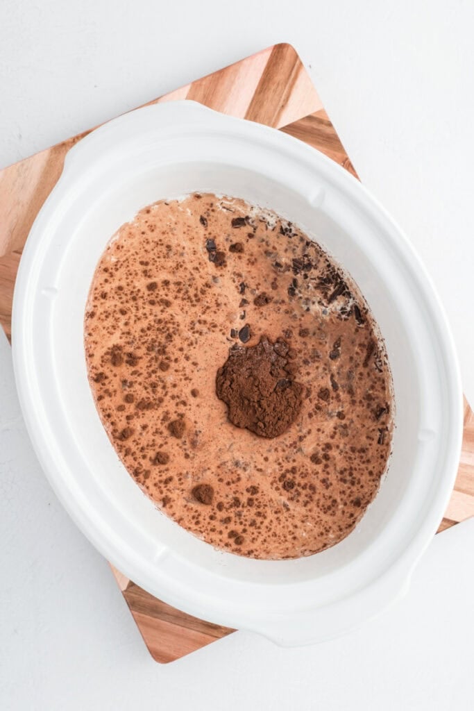Overhead process shot of all ingredients in slow cooker for slow cooker hot chocolate.