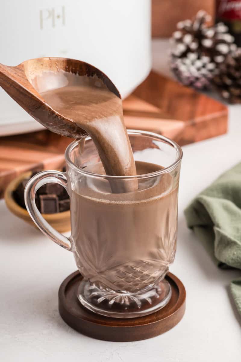 Slow Cooker Hot Chocolate bring poured into mug.
